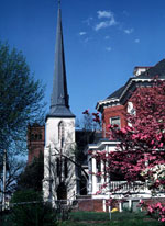 White church steeple and homes in Danville