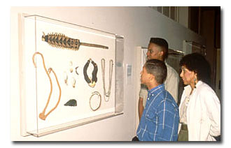 family looking at artwork at the Hampton University Museum