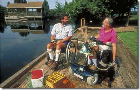 Two men in wheelchairs at Lake Anna